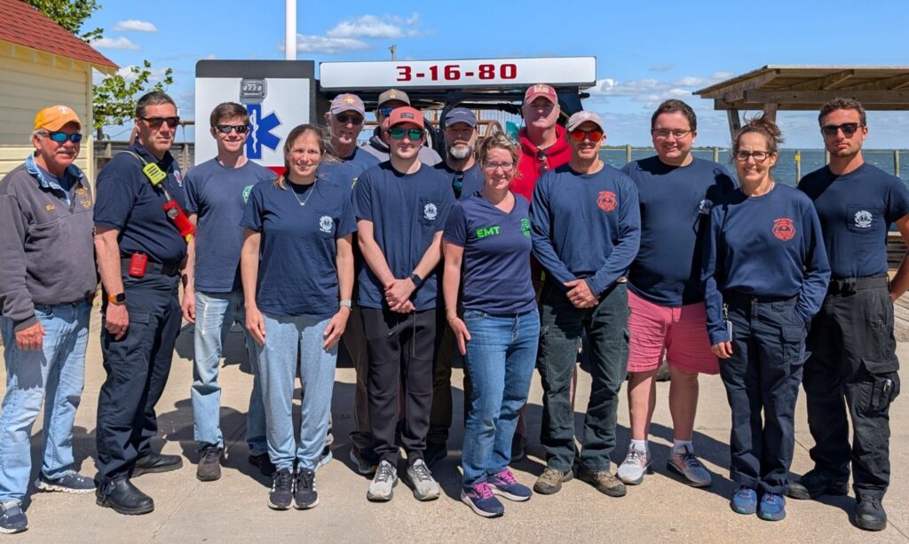 FHFD EMS Squad poses in front of Fair Harbor Bay Beach